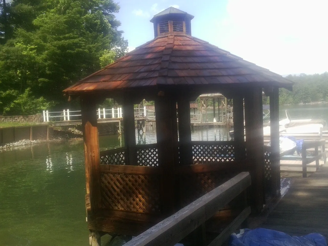 Cedar shake gazebo roof rebuilt on a lake dock in Mackinaw